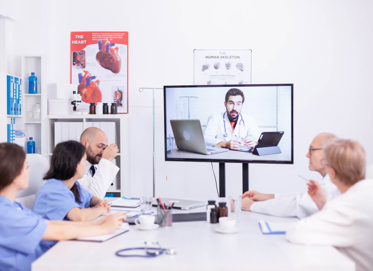 A patient on a video visit with her physician from her living room